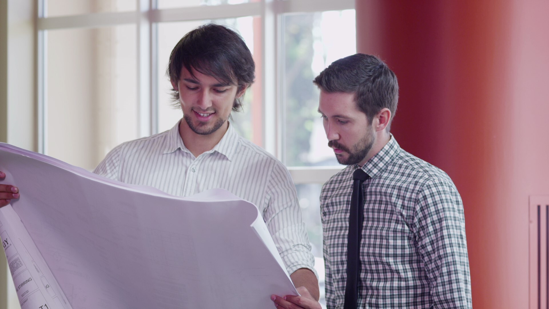 Team discussing blueprints